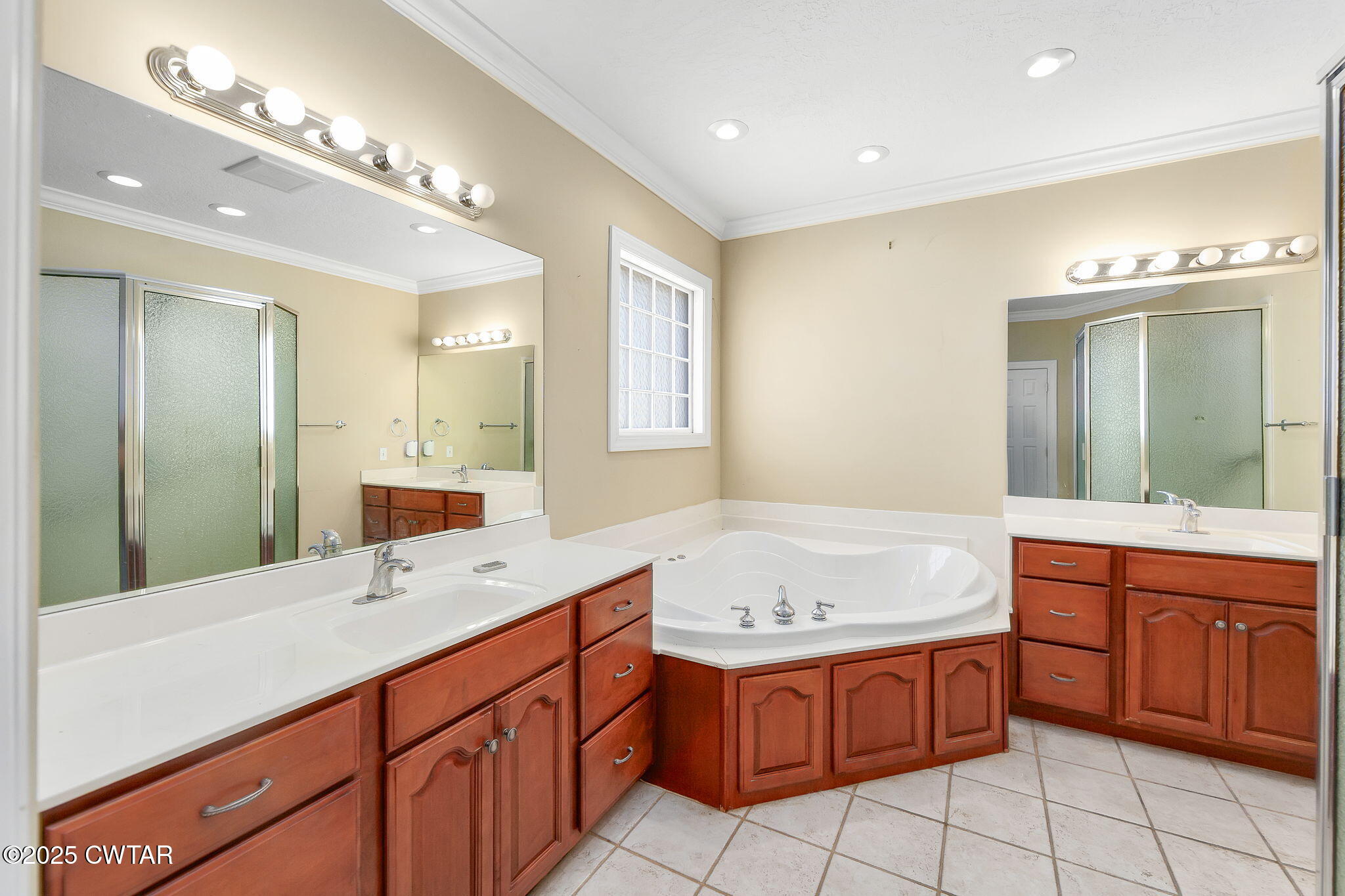 495 Sycamore Lane McKenzie, TN 38201 - Photo 15 of 21 a spacious bathroom with a granite countertop double vanity sink mirror and bathtub