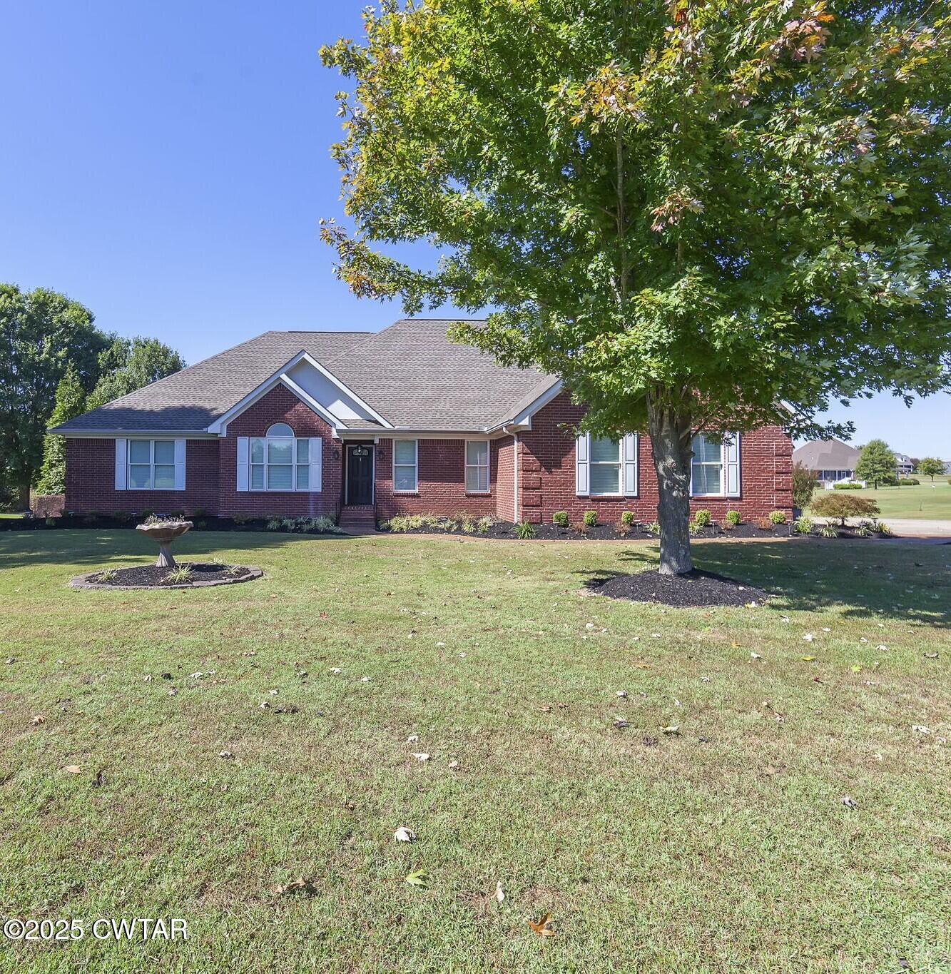 495 Sycamore Lane McKenzie, TN 38201 - Photo 2 of 21 a front view of a house with a yard