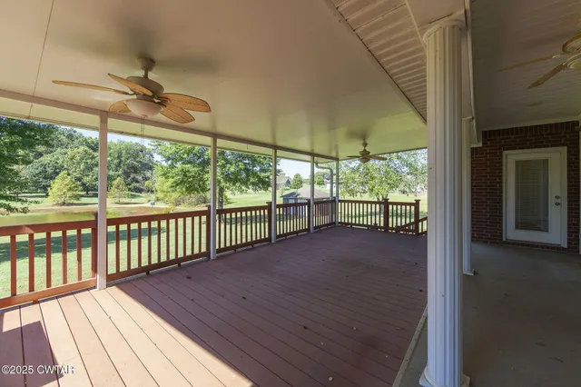 a view of a porch with wooden floor