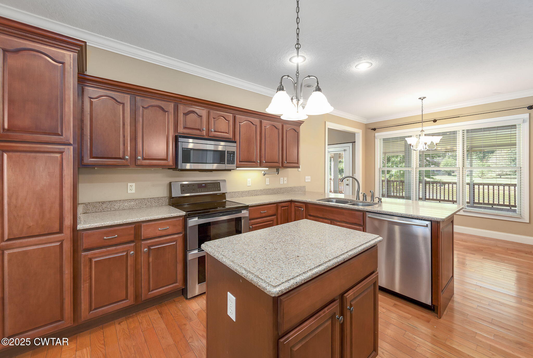 495 Sycamore Lane McKenzie, TN 38201 - Photo 10 of 21 a kitchen with a stove window and cabinets
