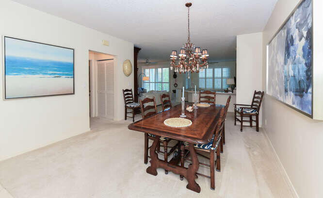 602 Mainsail Circle Jupiter, FL 33477 - Photo 3 of 39 a view of a dining room with furniture and chandelier