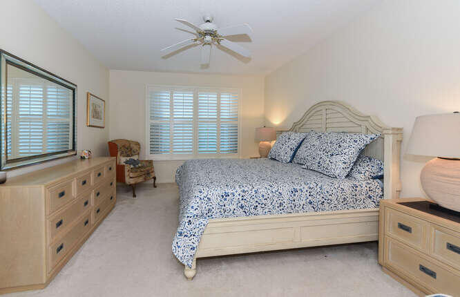 602 Mainsail Circle Jupiter, FL 33477 - Photo 10 of 39 a bedroom with a bed and a window