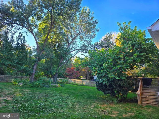 a view of a dining room with furniture wooden floor and chandelier