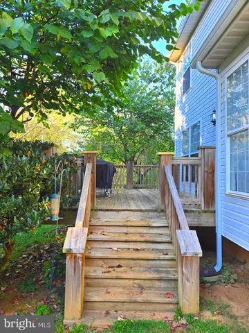 a dining room with furniture window and wooden floor