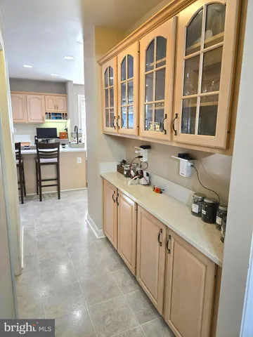 a view of a dining room with furniture and a window