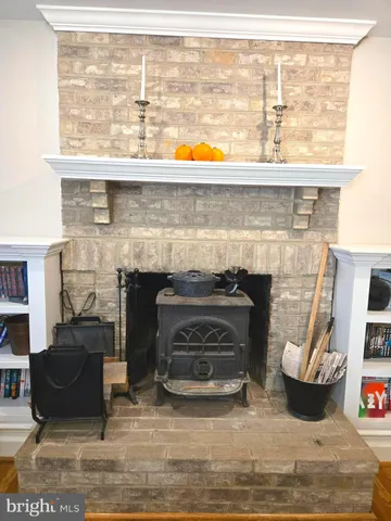 a living room with a large window and a table