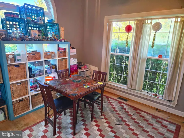 a bedroom with a bed and a mirror