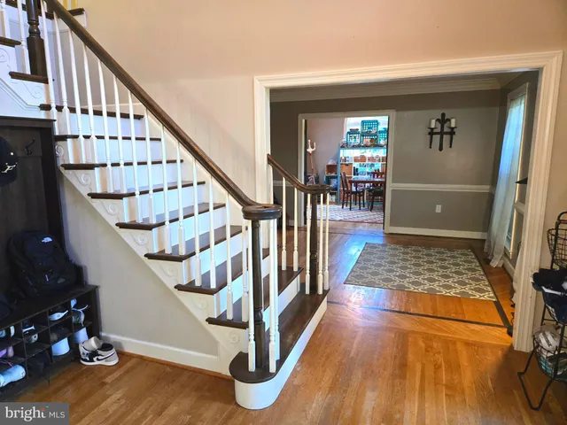 a living room with furniture gym equipment and a flat screen tv