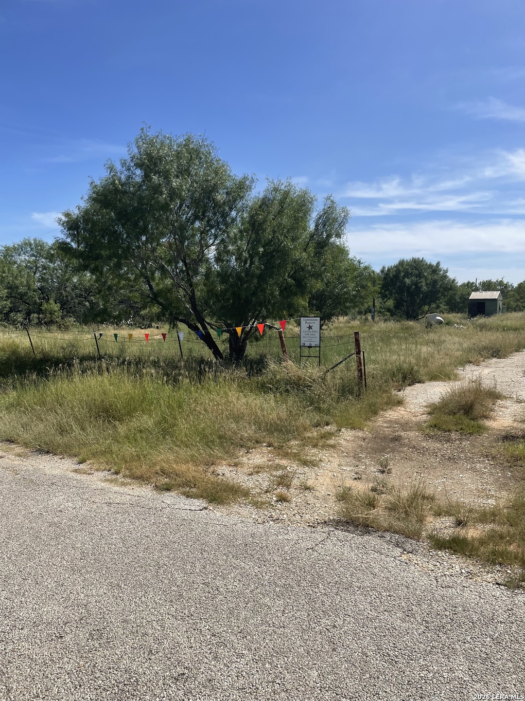 a view of a lake with houses in the back