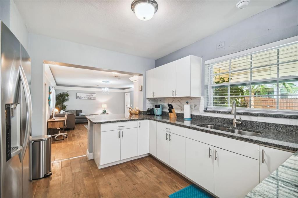 3915 North Ridge Avenue Tampa, FL 33603 - Photo 16 of 52 a kitchen with a sink cabinets and window