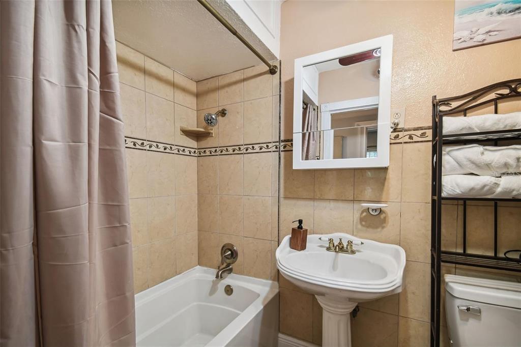 3915 North Ridge Avenue Tampa, FL 33603 - Photo 24 of 52 a bathroom with a sink and mirror