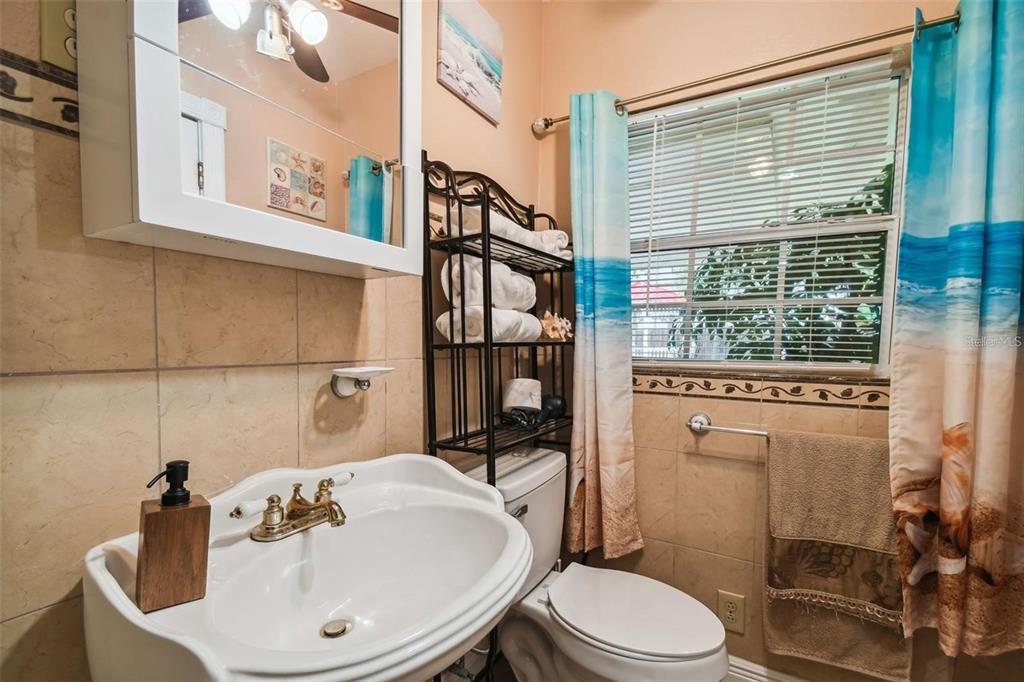3915 North Ridge Avenue Tampa, FL 33603 - Photo 25 of 52 a bathroom with a sink a toilet and shower