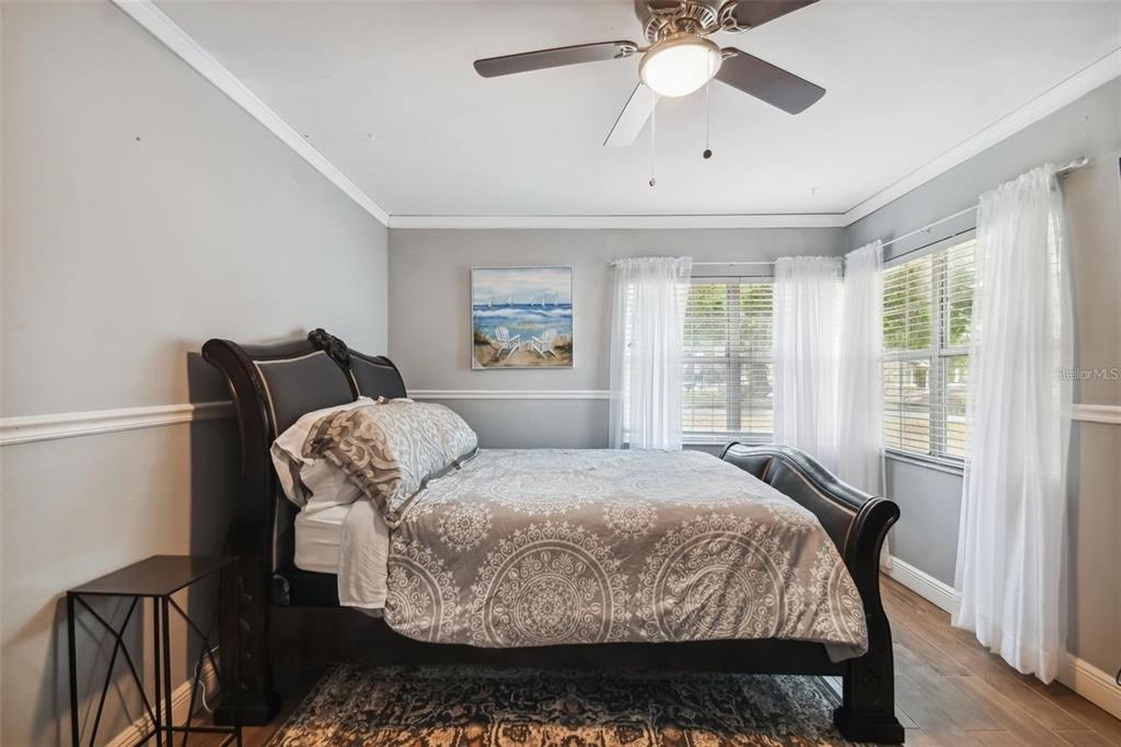 3915 North Ridge Avenue Tampa, FL 33603 - Photo 30 of 52 a bedroom with a bed and wooden floor