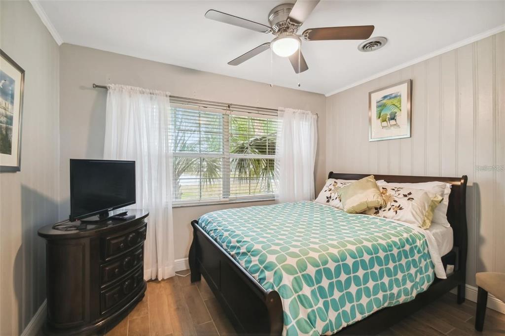 3915 North Ridge Avenue Tampa, FL 33603 - Photo 31 of 52 a bedroom with a bed and a flat screen tv