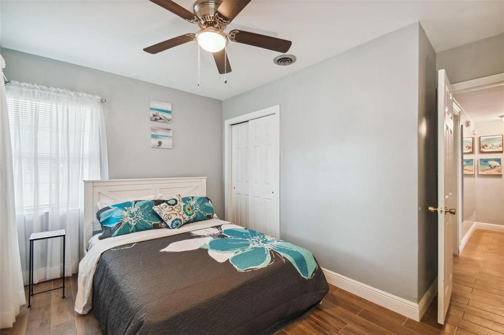 3915 North Ridge Avenue Tampa, FL 33603 - Photo 34 of 52 a bedroom with a bed and wooden floor