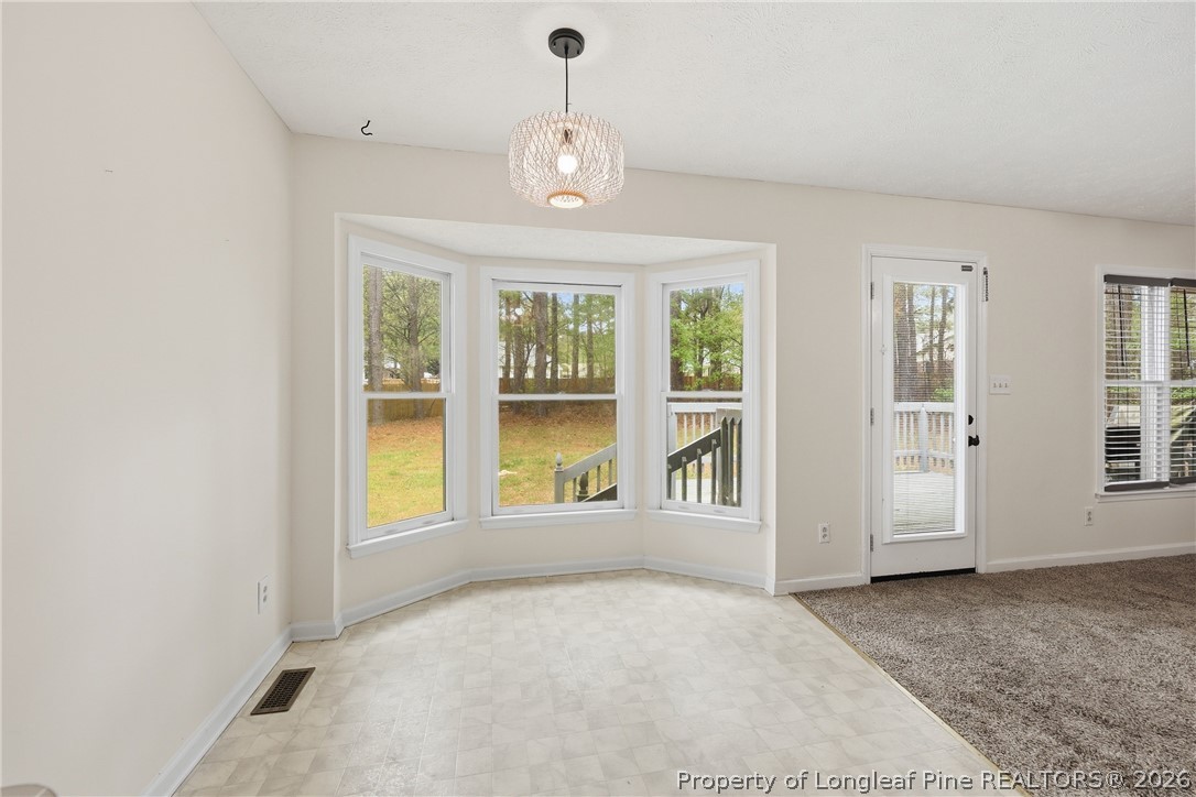 207 Cobblestone Court Raeford, NC 28376 - Photo 20 of 35 a view of an empty room with a window