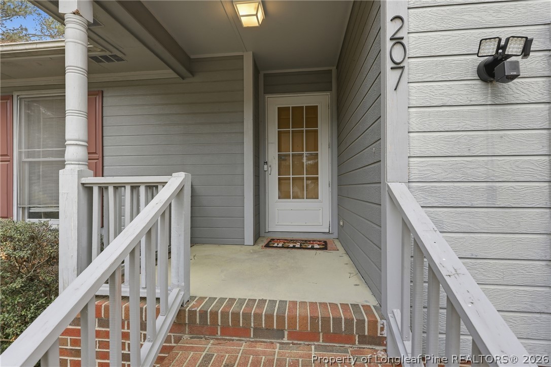 207 Cobblestone Court Raeford, NC 28376 - Photo 2 of 35 a view of entryway with a front door