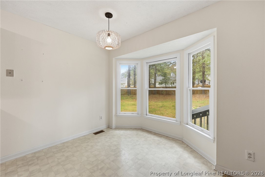 207 Cobblestone Court Raeford, NC 28376 - Photo 22 of 35 a view of an empty room with a window