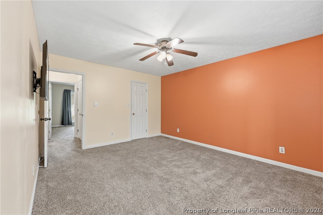 207 Cobblestone Court Raeford, NC 28376 - Photo 31 of 35 an empty room with closet and a chandelier fan