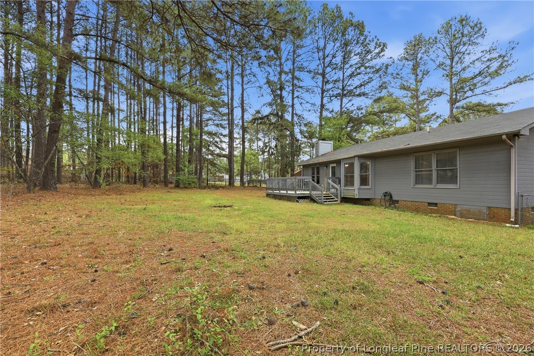 207 Cobblestone Court Raeford, NC 28376 - Photo 32 of 35 a front view of house with yard and trees
