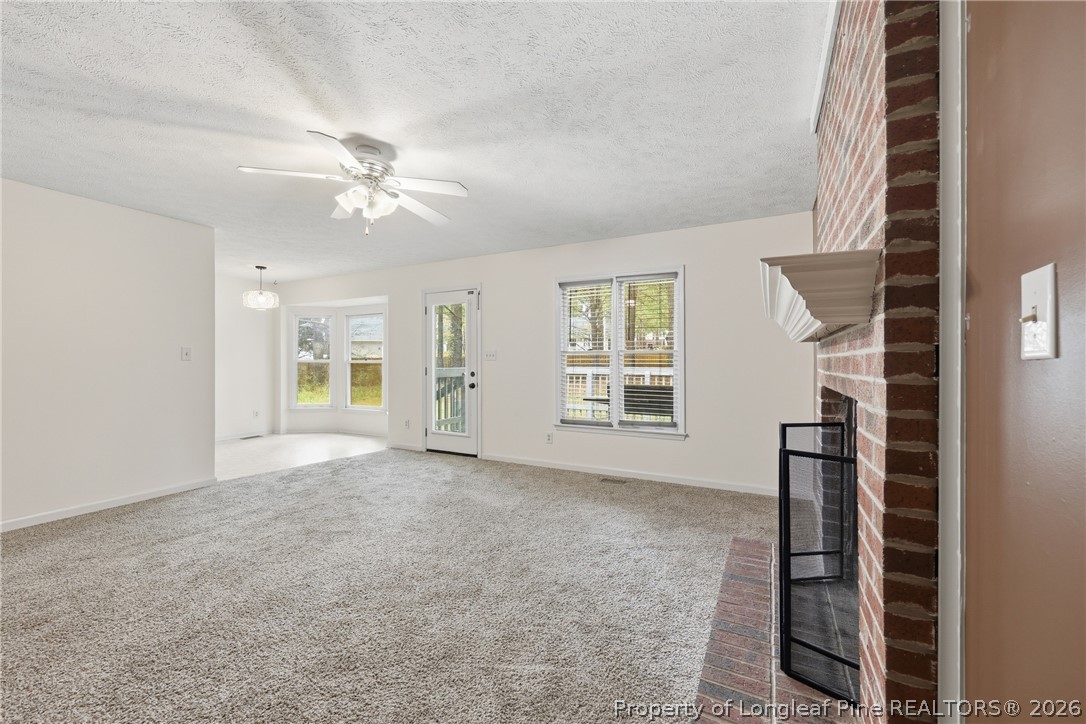 207 Cobblestone Court Raeford, NC 28376 - Photo 9 of 35 wooden floor in an empty room with a window