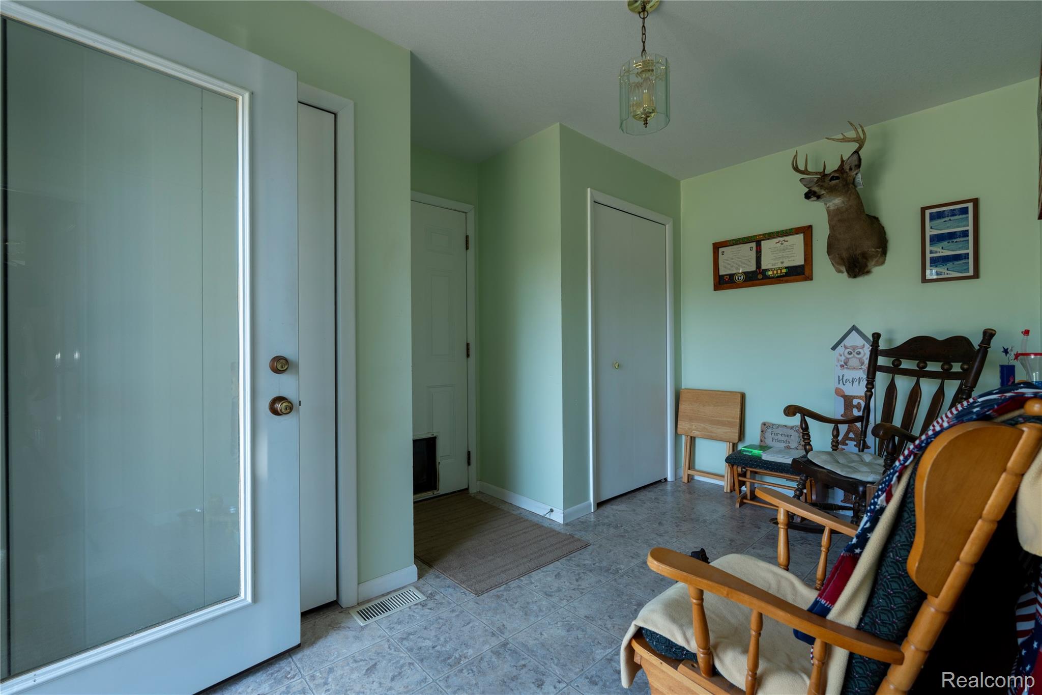 4180 Sage Lake Road Lupton, MI 48635 - Photo 26 of 40 Living area with baseboards and light flooring