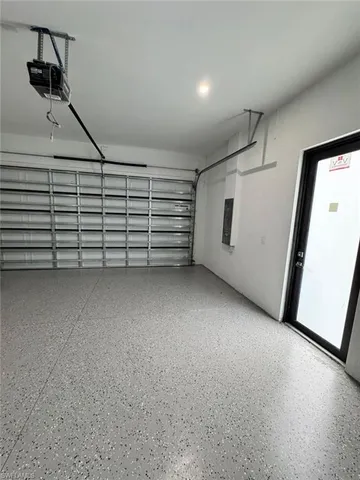 a view of a room with stairs and a cabinet