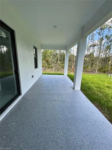 a view of a room with a large window