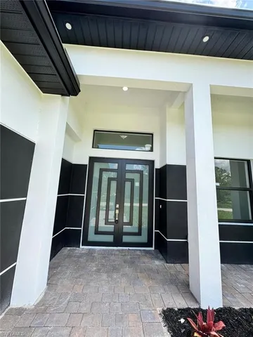 a view of entryway with wooden floor and stairs