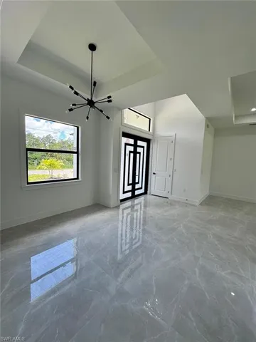 a large kitchen with kitchen island a sink stainless steel appliances and cabinets