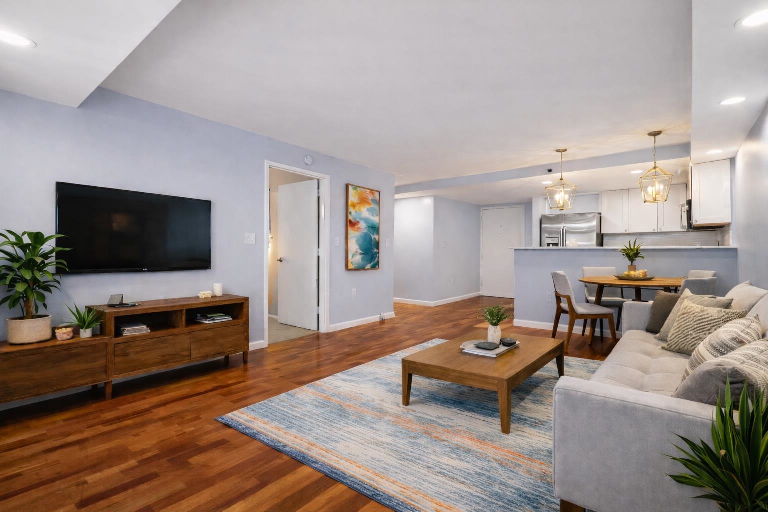 700 1st Street, Unit 5B Hoboken, NJ 07030 - Photo 2 of 14 a living room with furniture and a flat screen tv
