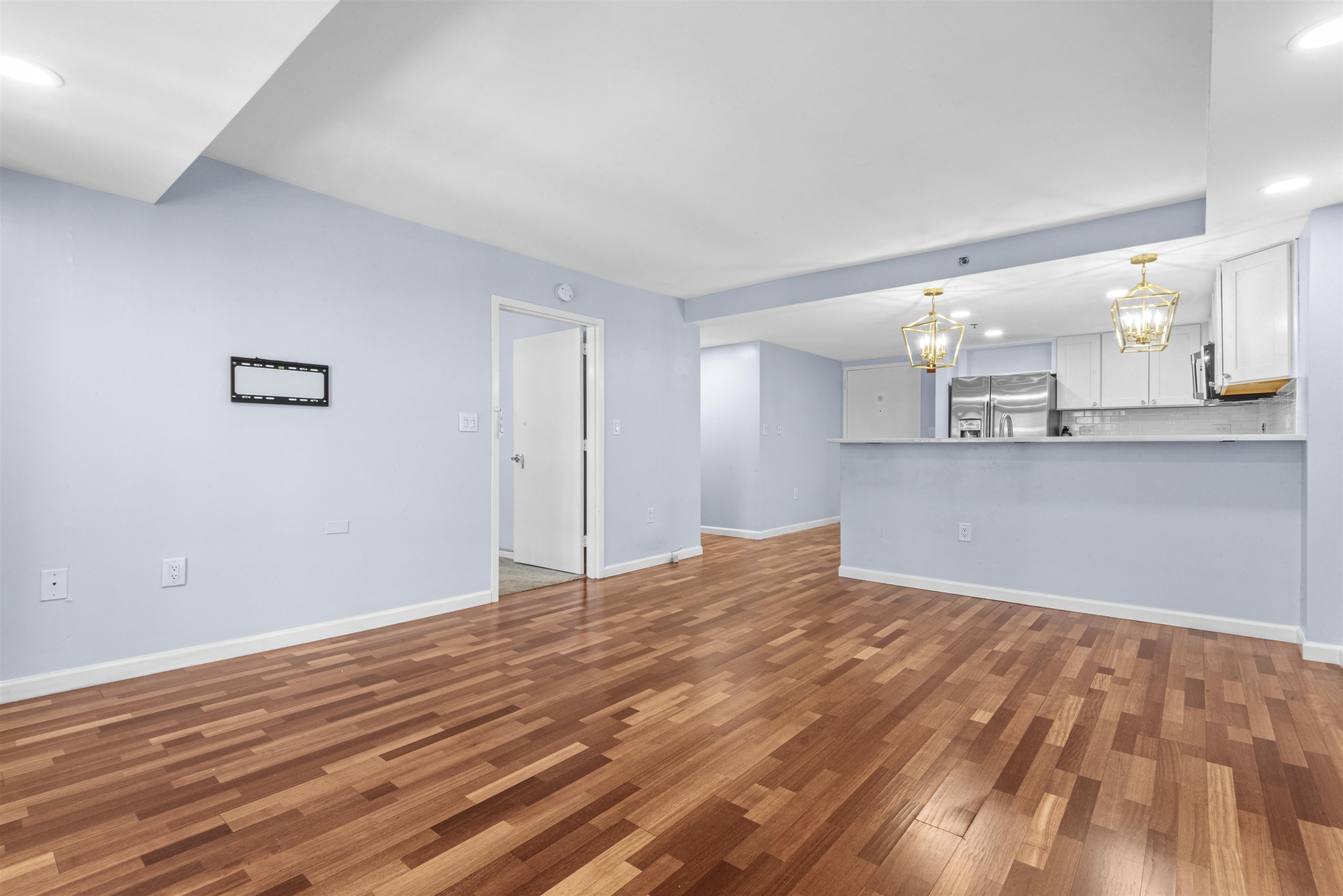 700 1st Street, Unit 5B Hoboken, NJ 07030 - Photo 5 of 14 a view of a kitchen with wooden floor and a sink
