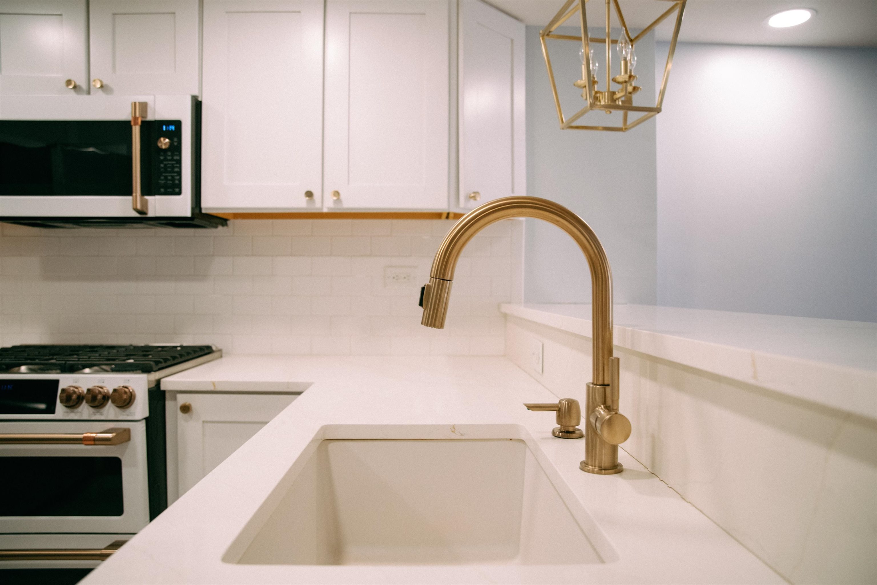 700 1st Street, Unit 5B Hoboken, NJ 07030 - Photo 10 of 14 a kitchen with a sink and a stove top oven