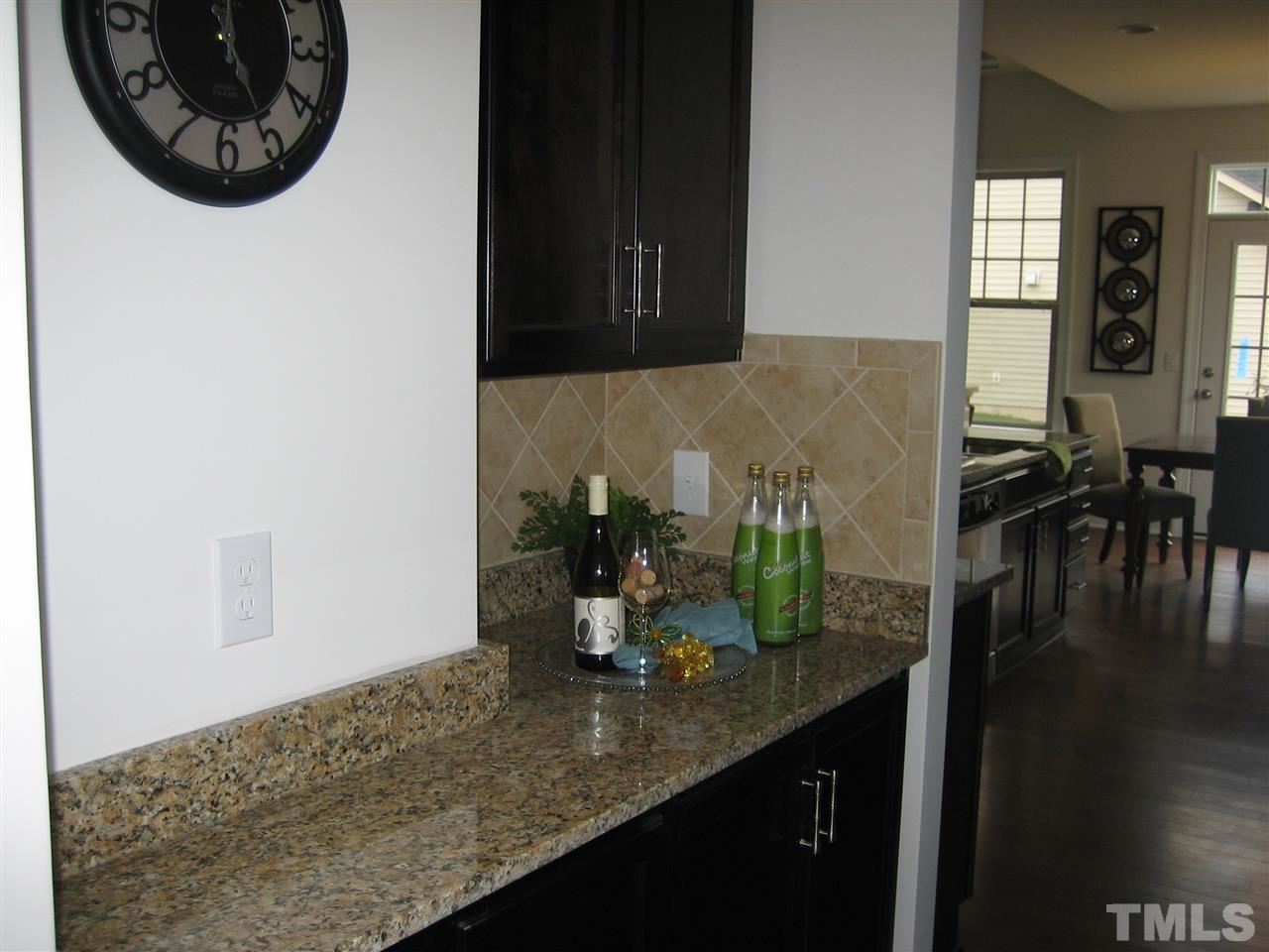 2445 Everstone Road Wake Forest, NC 27587 - Photo 11 of 22 Kona cabinets - Granite countertops. Between Formal dining and kitchen.
