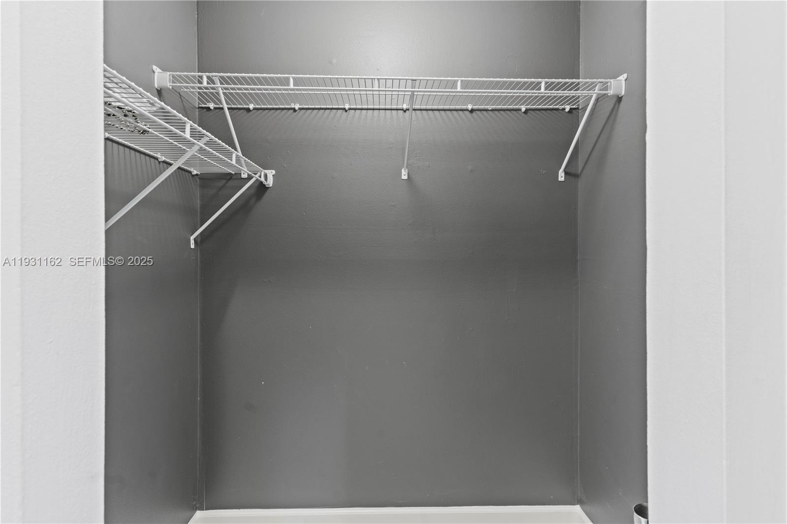 9301 Southwest 130th Street Miami, FL 33176 - Photo 21 of 32 a view of a room with racks on the wall