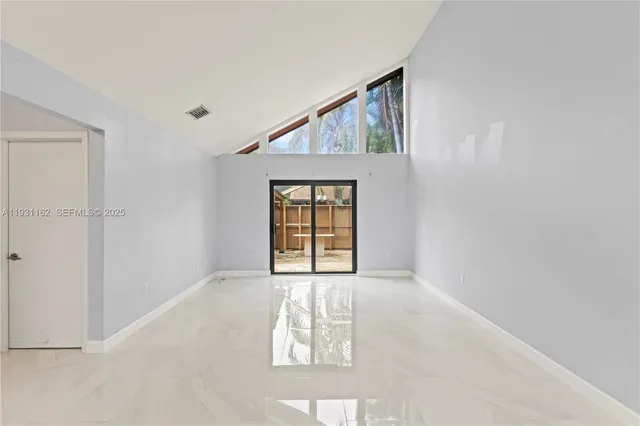 an empty room with windows