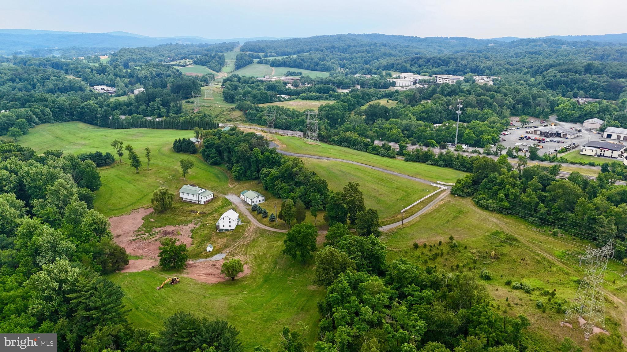 205 Fry Road Mohnton, PA 19540 - Photo 9 of 33 an aerial view of green landscape with trees houses and mountain view