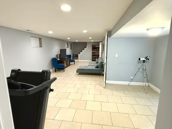 a kitchen with granite countertop a refrigerator and a sink