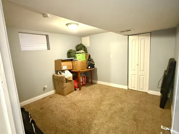 a bed room with a bed and a window