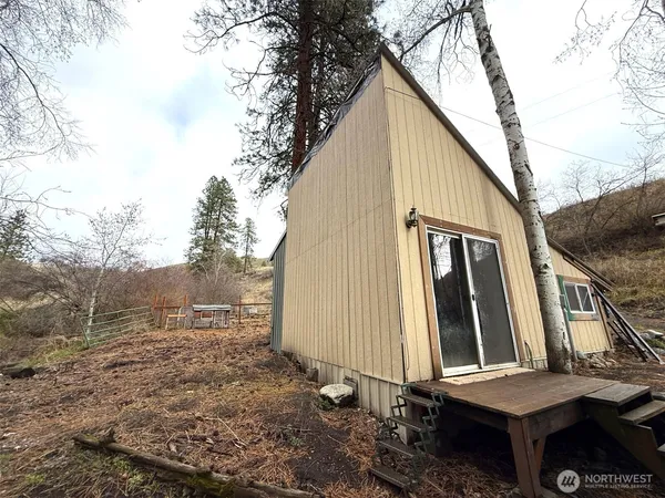 a view of a back yard with patio