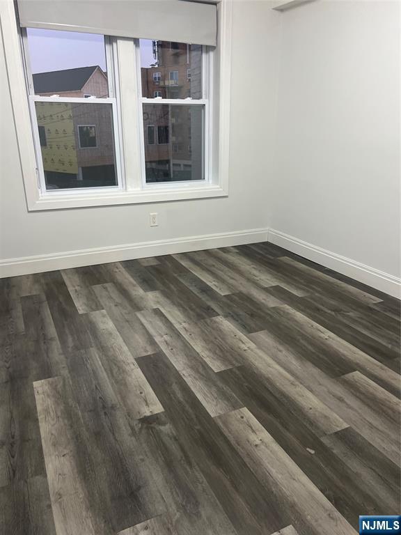 104 Park Avenue Rutherford, NJ 07070 - Photo 11 of 12 a view of a closet area with wooden floor