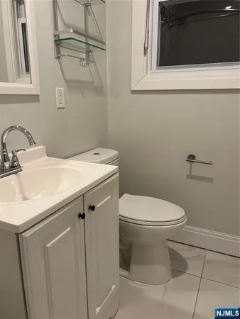 a bathroom with a sink toilet and vanity