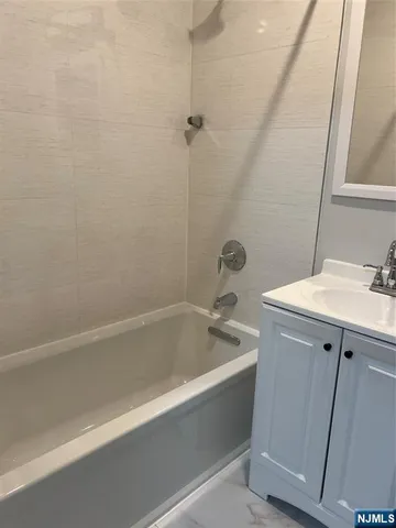 a bathroom with a sink and a bathtub