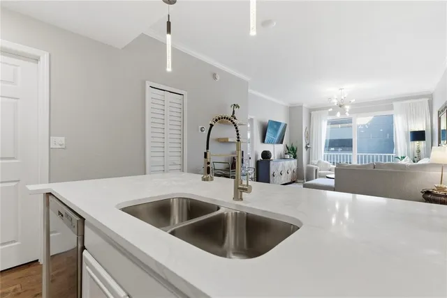 a kitchen with a sink cabinets and a stove