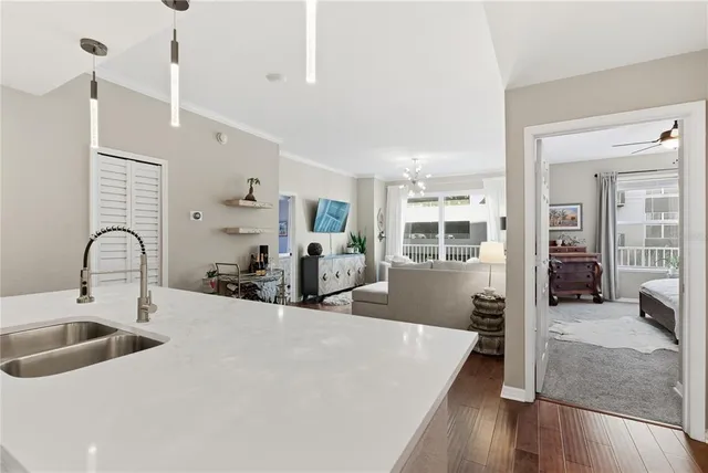 a kitchen with sink refrigerator and window