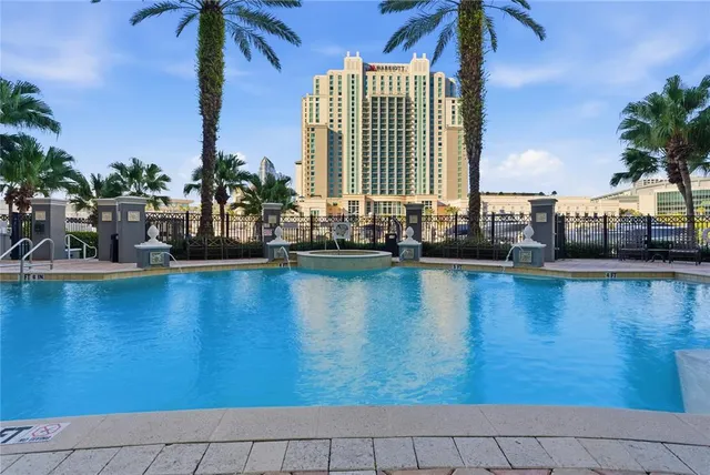a view of a swimming pool with outdoor seating
