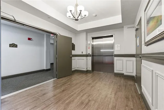 a view of a refrigerator in kitchen and wooden floor