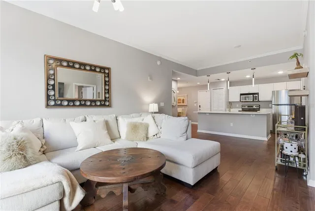 a living room with furniture and a painting