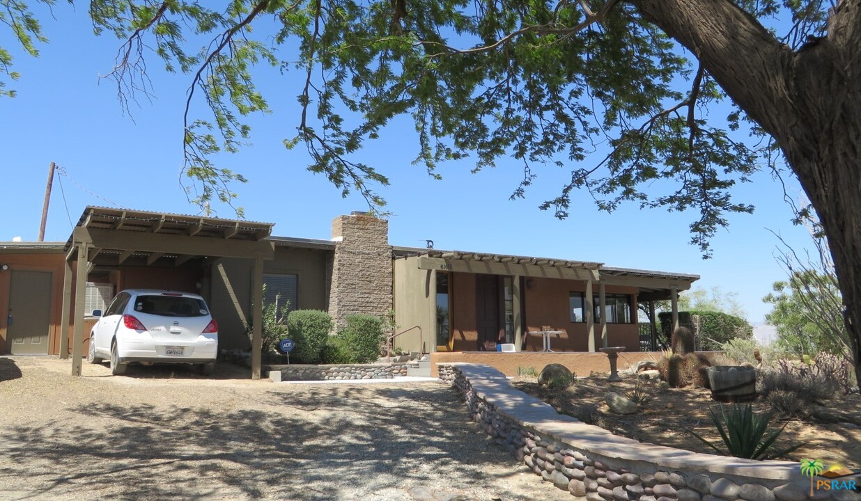 61612 Sagebrush Road North Palm Springs, CA 92258 - Photo 1 of 30 a view of a house with a tree in front of it