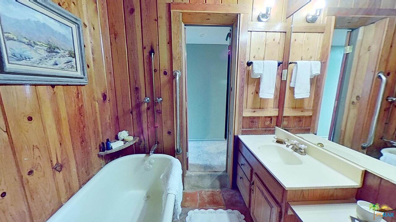 61612 Sagebrush Road North Palm Springs, CA 92258 - Photo 11 of 30 a bathroom with a tub sink and mirror